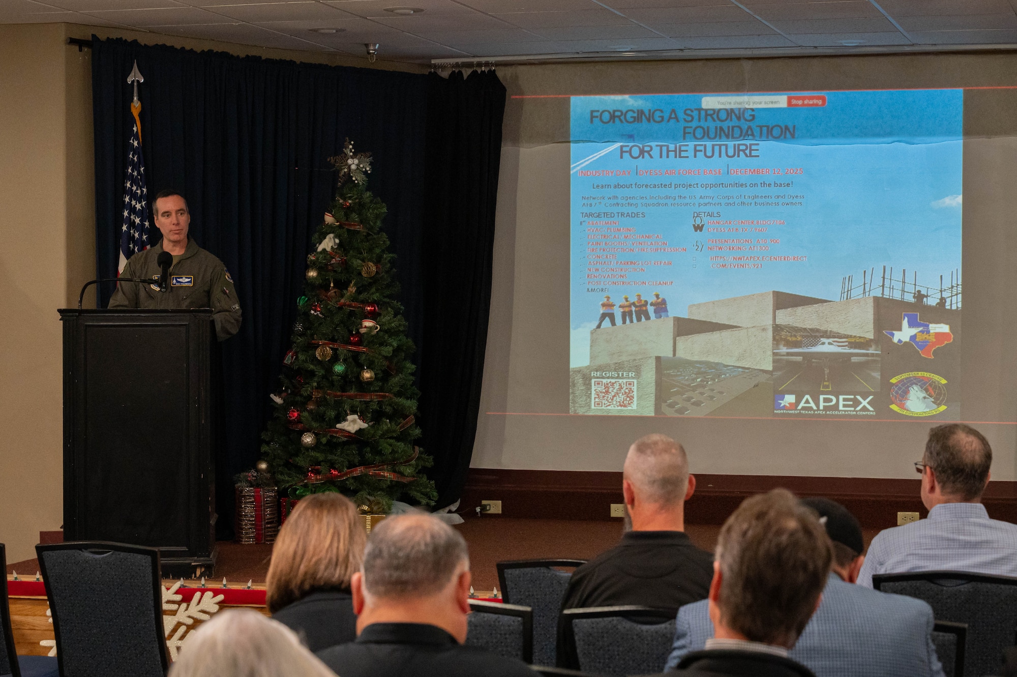 U.S. Air Force Col. Ryan Stallsworth, 7th Bomb Wing deputy commander, provides opening remarks during the B-21 Industry Day at Dyess Air Force Base, Texas, Dec. 12, 2025. The event provided a forum to discuss upcoming military construction opportunities, strengthening collaboration as Dyess prepares to become the third Main Operating Base for the B-21 Raider. (U.S. Air Force photo by Airman William Neal)
