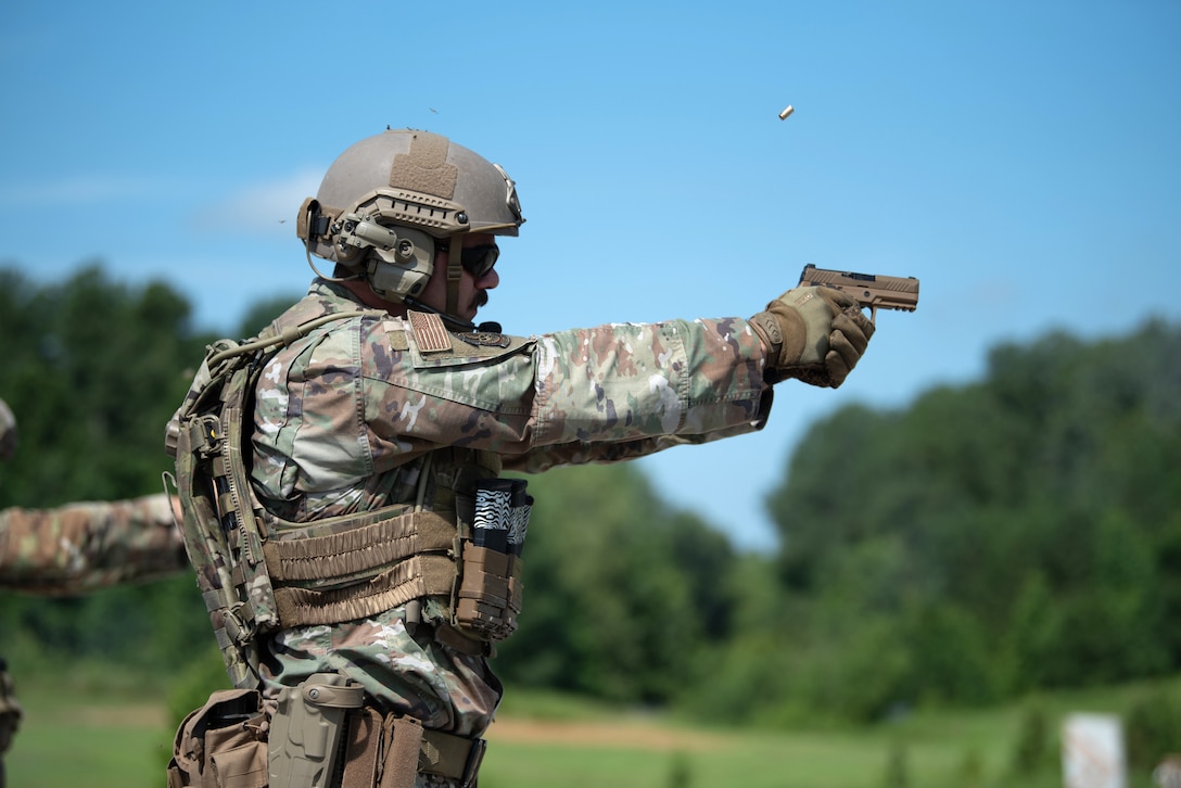 Tech. Sgt. Nicholas Miller of the Kentucky Air National Guard’s 123rd Contingency Response group fires an M18 pistol July 13, 2025, while competing in the Adjutant General’s Match, a marksmanship competition held at the Wendell H. Ford Regional Training center in Greenville, Ky. The event tested Soldiers and Airmen with realistic, combat-focused shooting scenarios designed to sharpen weapons proficiency and lethality. (U.S. Air National Guard photo by Airman 1st Class Angelee Barnett)