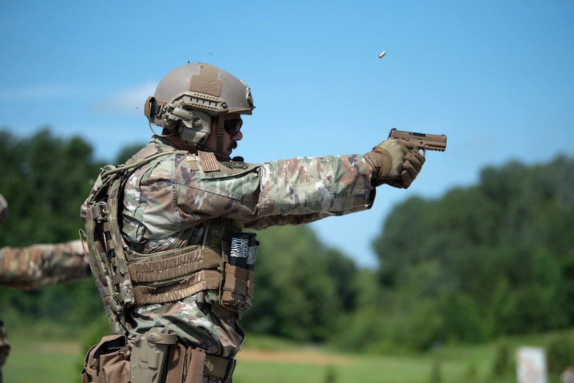 Tech. Sgt. Nicholas Miller of the Kentucky Air National Guard’s 123rd Contingency Response group fires an M18 pistol July 13, 2025, while competing in the Adjutant General’s Match, a marksmanship competition held at the Wendell H. Ford Regional Training center in Greenville, Ky. The event tested Soldiers and Airmen with realistic, combat-focused shooting scenarios designed to sharpen weapons proficiency and lethality. (U.S. Air National Guard photo by Airman 1st Class Angelee Barnett)