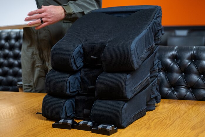 Kalogon systems engineers provide three smart cushions for aircrew from the 49th Test and Evaluation Squadron to test on a U.S. Air Force B-52H Stratofortress at Barksdale Air Force Base, La., Nov. 3, 2025. Kalogon engineers revised the cushion based on earlier feedback to improve performance in real-world missions. (U.S. Air Force photo by Airman 1st Class Devyn Taylor)