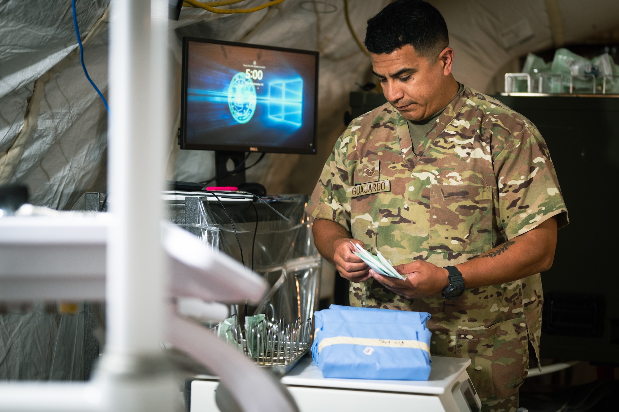 U.S. Air Force Staff Sgt. Miguel Guajardo, 378th EMDS dental clinic non-commissioned officer in charge, prepares utensils to be sterilized