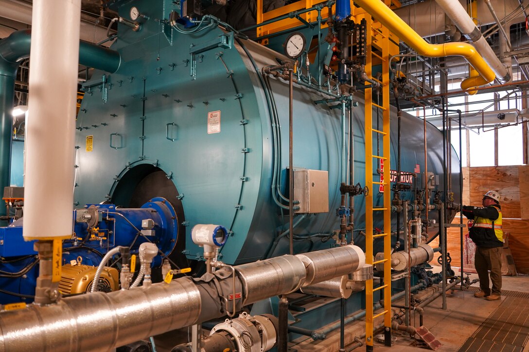 A contractor makes adjustments to one of the boilers in the Central Utility Plant at the Louisville VA Medical Center Dec. 10, 2025. Boilers will be used in a variety of systems throughout the medical center and supporting infrastructure.