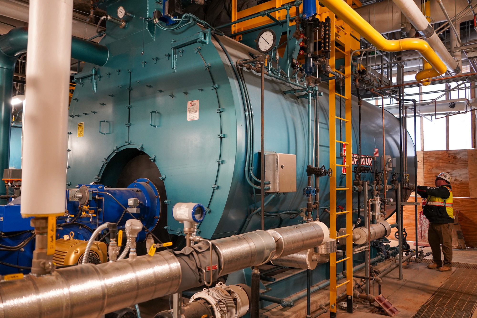 A contractor makes adjustments to one of the boilers in the Central Utility Plant at the Louisville VA Medical Center Dec. 10, 2025. Boilers will be used in a variety of systems throughout the medical center and supporting infrastructure.