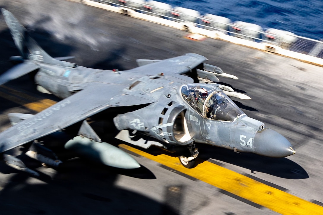 A U.S. Marine Corps AV-8B Harrier with Marine Medium Tiltrotor Squadron (VMM) 263 (Reinforced), 22nd Marine Expeditionary Unit (Special Operations Capable), takes off during flight operations aboard Wasp-class amphibious assault USS Iwo Jima (LHD 7) while underway in the Caribbean Sea, Nov. 28, 2025. U.S. military forces are deployed to the Caribbean in support of the U.S. Southern Command mission, Department of War-directed operations, and the president’s priorities to disrupt illicit drug trafficking and protect the homeland. (U.S. Marine Corps photo)