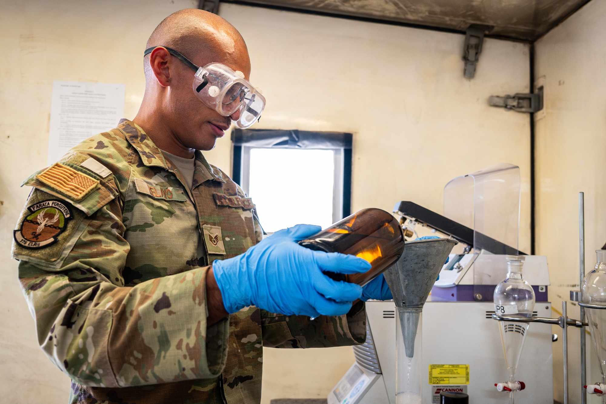 U.S. Air Force Staff Sgt. Fabian Pelayo, 378th Expeditionary Logistics Readiness Squadron fuels laboratory technician, tests fuel samples