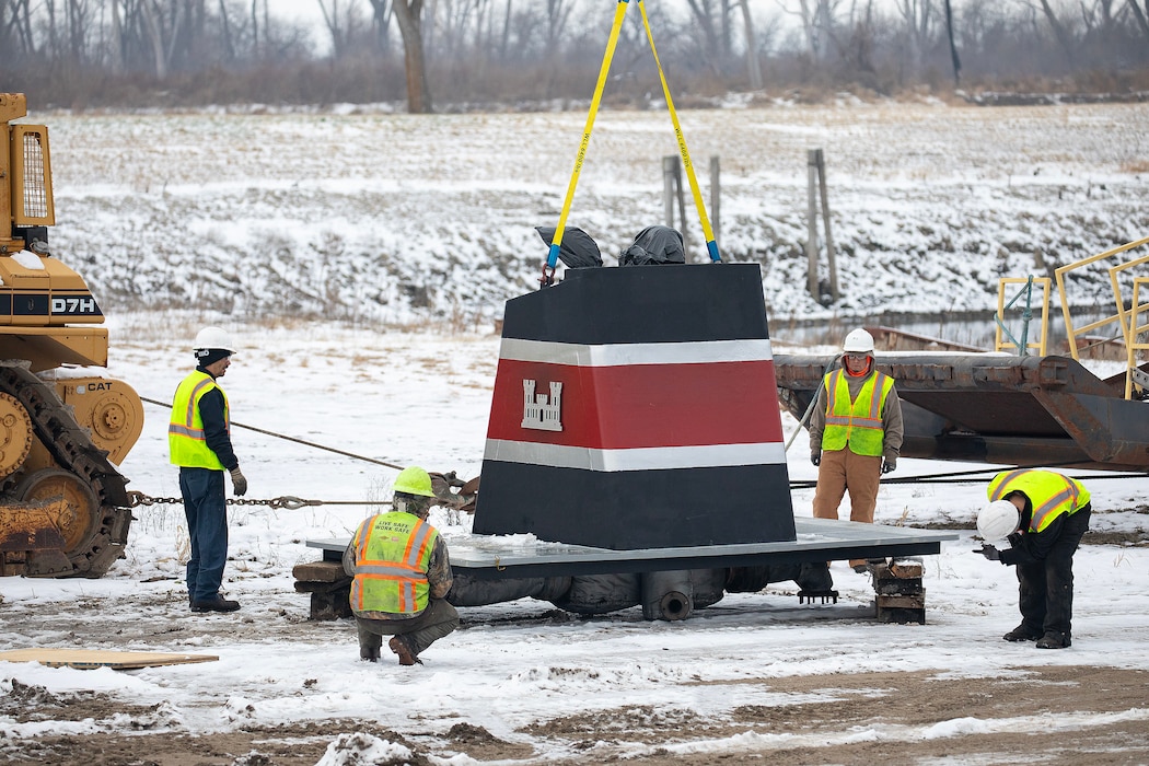 A photo of eingines being removed from a towboat.