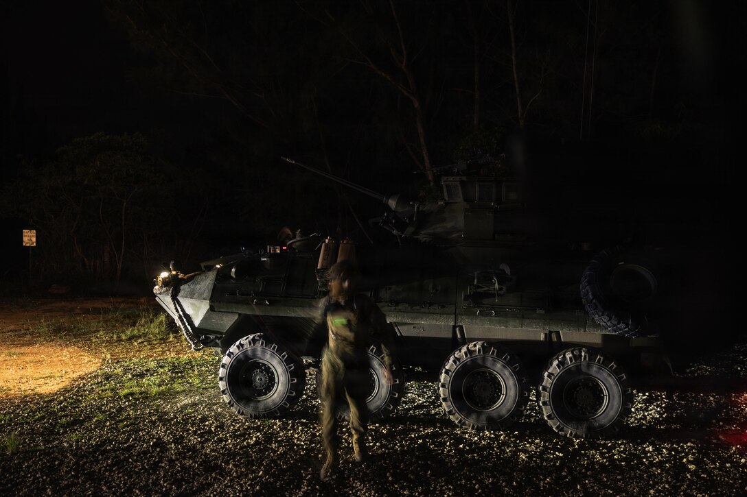 A U.S. Marine with Weapons Company, Battalion Landing Team 3rd Battalion, 1st Marine Regiment, 31st Marine Expeditionary Unit, prepares a light armored vehicle for convoy operations during a simulated tactical recovery of aircraft personnel exercise as part of MEU Exercise at Camp Schwab, Okinawa, Japan, Dec. 10, 2025. The simulated TRAP exercise showcased advanced trauma life support capabilities and evaluated the platoon’s rapid response and recovery tactics of downed aircraft, personnel and equipment in isolated locations. The 31st MEU, the Marine Corps’ only continuously forward deployed MEU, provides a flexible and lethal force, ready to perform a wide range of military operations as the premiere crisis response force in the Indo-Pacific region. (U.S. Marine Corps photo by Sgt. Alora Finigan)