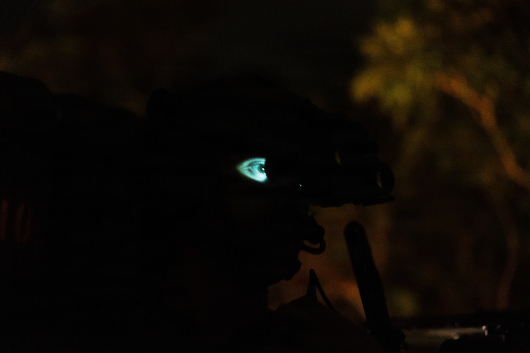 A U.S. Marine with Weapons Company, Battalion Landing Team 3rd Battalion, 1st Marine Regiment, 31st Marine Expeditionary Unit, maintains security from a light armored vehicle-logistics during a simulated tactical recovery of aircraft personnel exercise as part of MEU Exercise at Camp Schwab, Okinawa, Japan, Dec. 10, 2025. The simulated TRAP exercise showcased advanced trauma life support capabilities and evaluated the platoon’s rapid response and recovery tactics of downed aircraft, personnel and equipment in isolated locations. The 31st MEU, the Marine Corps’ only continuously forward deployed MEU, provides a flexible and lethal force, ready to perform a wide range of military operations as the premiere crisis response force in the Indo-Pacific region. (U.S. Marine Corps photo by Sgt. Alora Finigan)