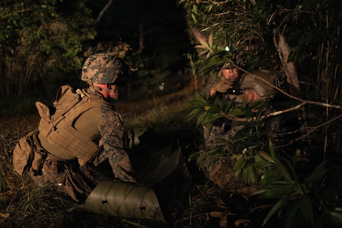 U.S. Marines with Weapons Company, Battalion Landing Team 3rd Battalion, 1st Marine Regiment, 31st Marine Expeditionary Unit, prepare to transport a simulated casualty during a simulated tactical recovery of aircraft personnel exercise as part of MEU Exercise at Camp Schwab, Okinawa, Japan, Dec. 10, 2025. The simulated TRAP exercise showcased advanced trauma life support capabilities and evaluated the platoon’s rapid response and recovery tactics of downed aircraft, personnel and equipment in isolated locations. The 31st MEU, the Marine Corps’ only continuously forward deployed MEU, provides a flexible and lethal force, ready to perform a wide range of military operations as the premiere crisis response force in the Indo-Pacific region. (U.S. Marine Corps photo by Sgt. Alora Finigan)