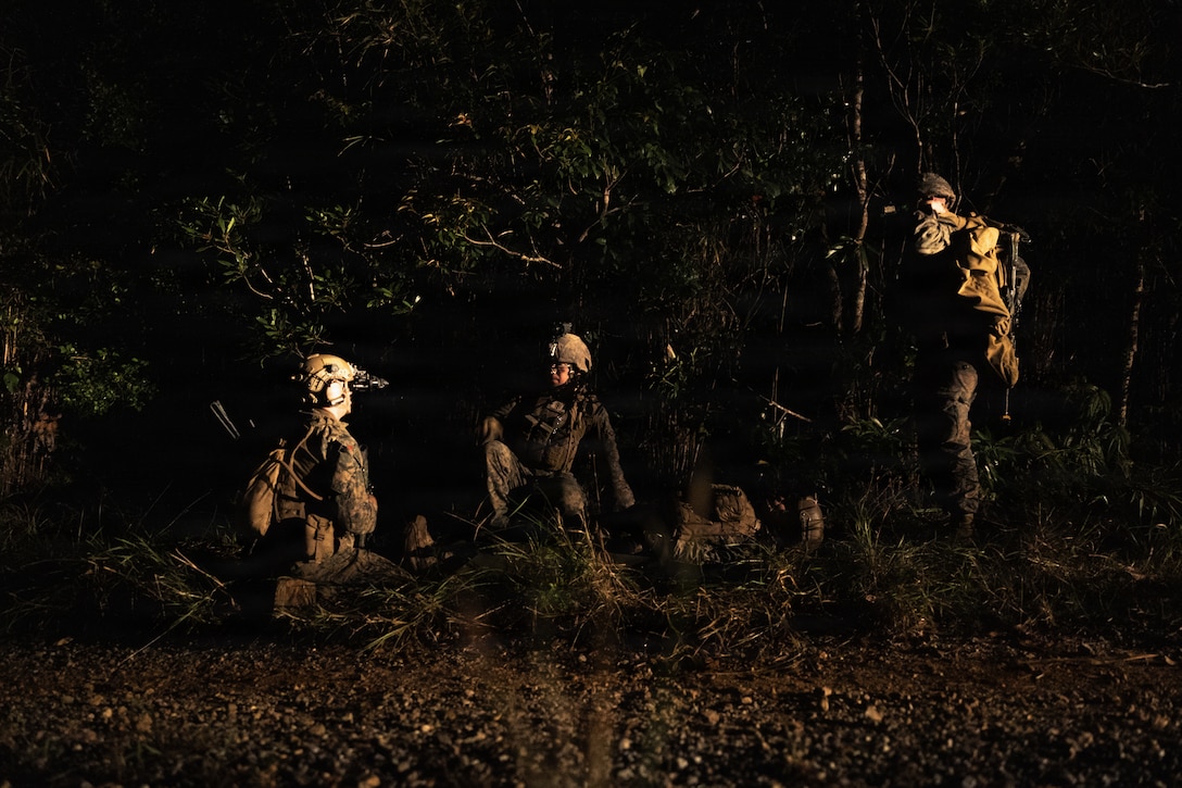 U.S. Marines with Weapons Company, Battalion Landing Team 3rd Battalion, 1st Marine Regiment, 31st Marine Expeditionary Unit, prepare to transport a simulated casualty during a simulated tactical recovery of aircraft personnel exercise as part of MEU Exercise at Camp Schwab, Okinawa, Japan, Dec. 10, 2025. The simulated TRAP exercise showcased advanced trauma life support capabilities and evaluated the platoon’s rapid response and recovery tactics of downed aircraft, personnel and equipment in isolated locations. The 31st MEU, the Marine Corps’ only continuously forward deployed MEU, provides a flexible and lethal force, ready to perform a wide range of military operations as the premiere crisis response force in the Indo-Pacific region. (U.S. Marine Corps photo by Sgt. Alora Finigan)