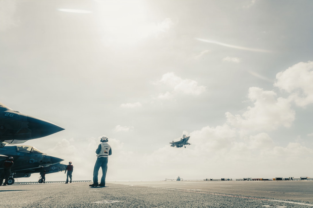 A U.S. Marine Corps F-35B Lightning II assigned to Marine Fighter Attack Squadron (VMFA) 242, 31st Marine Expeditionary Unit, prepares to land aboard the forward-deployed amphibious assault carrier USS Tripoli (LHA 7), flagship of the Tripoli Expeditionary Strike Group, Dec. 7, 2025, while conducting routine operations in the U.S. 7th Fleet Area of Operations. The 31st MEU, the Marine Corps’ only continuously forward-deployed MEU, provides a flexible and lethal force ready to perform a wide range of military operations as the premiere crisis response force in the Indo-Pacific region. (U.S. Marine Corps photo by Lance Cpl. Raul Sotovilla)