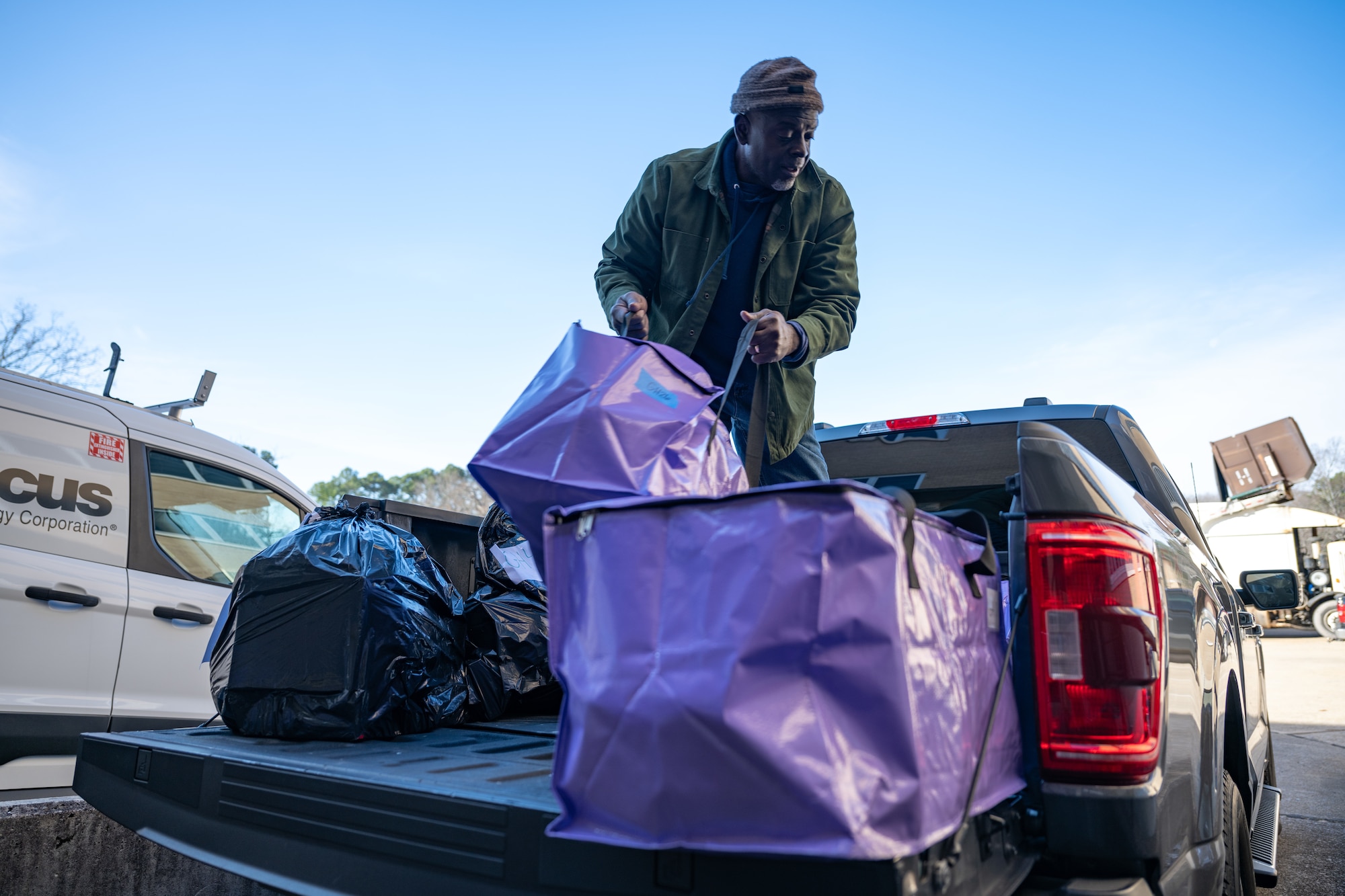 Neail Tyson loads a bag of items purchased by Arnold AFB team members through the Project Christmas program. This year, 105 children were sponsored and will receive gifts from Arnold personnel. (U.S. Air Force photo by Keith Thornburgh)