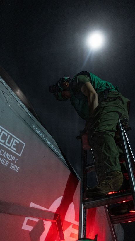 U.S. Marines with Marine Fighter Attack Squadron (VMFA) 242, 31st Marine Expeditionary Unit, prepare to load ordinance onto an F-35B Lightning II aboard the forward-deployed amphibious assault carrier USS Tripoli (LHA 7), flagship of the Tripoli Expeditionary Strike Group, Dec. 7, 2025, while conducting routine operations in the U.S. 7th Fleet Area of Operations. The 31st MEU, the Marine Corps’ only continuously forward-deployed MEU, provides a flexible and lethal force ready to perform a wide range of military operations as the premiere crisis response force in the Indo-Pacific region. (U.S. Marine Corps photo by Lance Cpl. Raul Sotovilla)