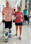 Retired Army Master Sgt. Chris Hiatt walks with his wife, Angela Hiatt, at the U.S. Army Institute of Surgical Research Burn Center located within Brooke Army Medical Center, Joint Base San Antonio-Fort Sam Houston, Texas. Hiatt spent 68 days in the USAISR Burn Center during his recovery after his small plane crash landed and caught fire. (Courtesy Photo)