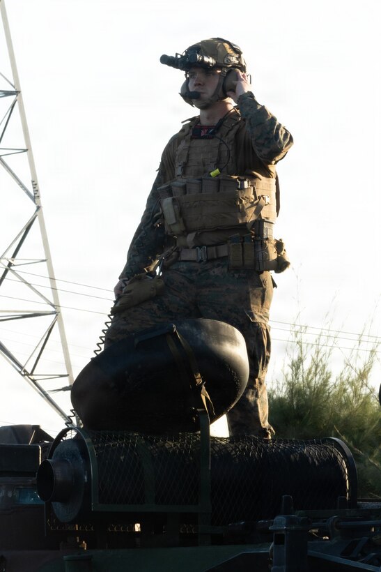 A U.S. Marine with Kilo Company, Battalion Landing Team 3rd Battalion, 1st Marine Regiment, 31st Marine Expeditionary Unit, prepares to disembark for a mechanized raid on Camp Hansen, Okinawa, Japan, Dec. 05, 2025. The raid was conducted to enhance efficiency and efficacy of ship-to-shore operations utilizing mechanized assets. The 31st MEU, the Marine Corps’ only continuously forward-deployed MEU, provides a flexible and lethal force ready to perform a wide range of military operations as the premiere crisis response force in the Indo-Pacific region. (U.S. Marine Corps photo by Cpl. Maksim Masloboev)