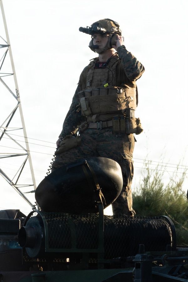 A U.S. Marine with Kilo Company, Battalion Landing Team 3rd Battalion, 1st Marine Regiment, 31st Marine Expeditionary Unit, prepares to disembark for a mechanized raid on Camp Hansen, Okinawa, Japan, Dec. 05, 2025. The raid was conducted to enhance efficiency and efficacy of ship-to-shore operations utilizing mechanized assets. The 31st MEU, the Marine Corps’ only continuously forward-deployed MEU, provides a flexible and lethal force ready to perform a wide range of military operations as the premiere crisis response force in the Indo-Pacific region. (U.S. Marine Corps photo by Cpl. Maksim Masloboev)