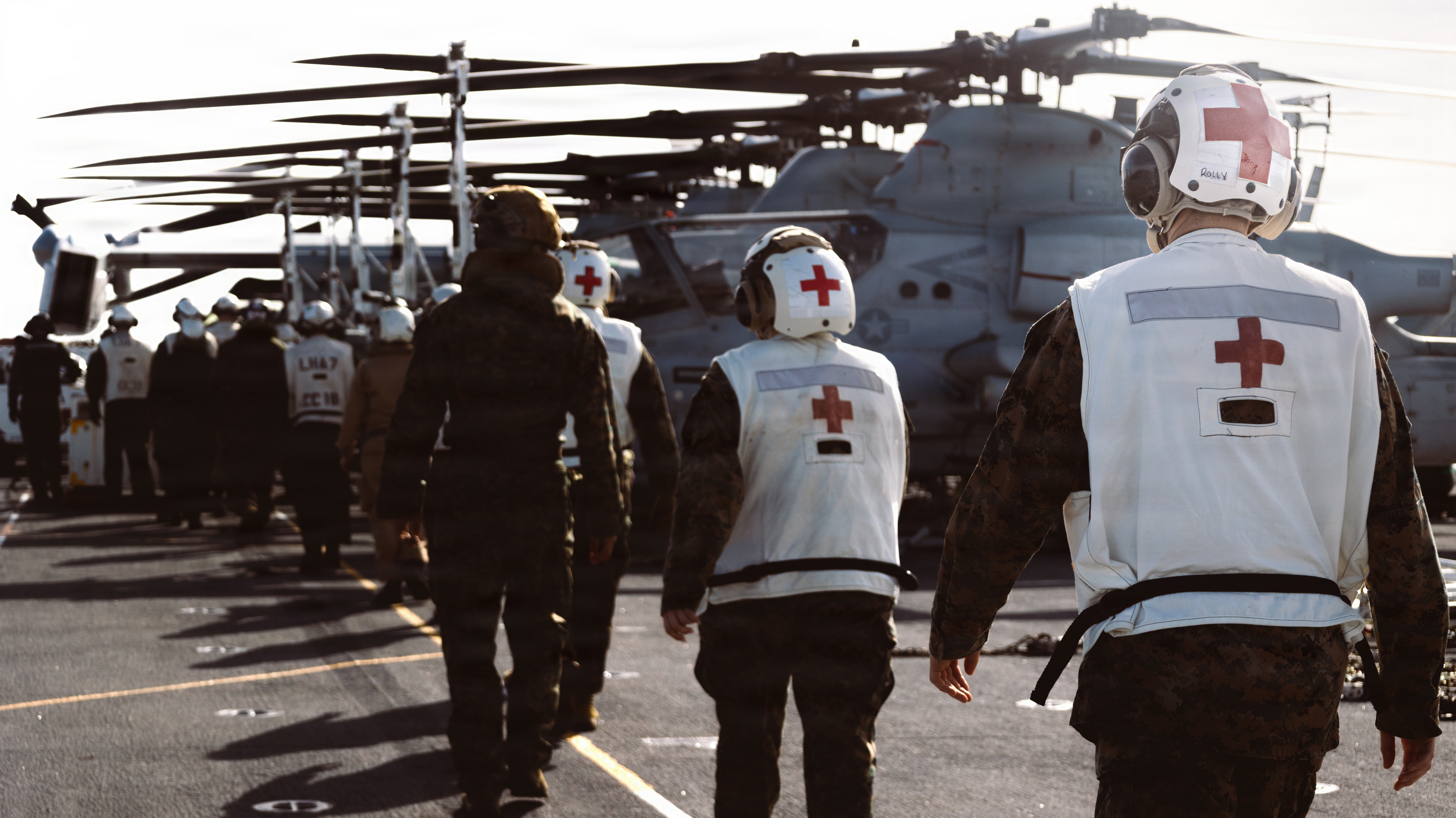U.S. Marines and Navy Sailors with the 31st Marine Expeditionary Unit, prepare to conduct Tactical Combat Casualty Care on a simulated casualty aboard the forward-deployed amphibious assault carrier USS Tripoli (LHA 7), flagship of the Tripoli Expeditionary Strike Group, Dec. 6, 2025, while conducting routine operations in the U.S. 7th Fleet Area of Operations. The 31st MEU, the Marine Corps’ only continuously forward-deployed MEU, provides a flexible and lethal force ready to perform a wide range of military operations as the premiere crisis response force in the Indo-Pacific region. (U.S. Marine Corps photo by Lance Cpl. Raul Sotovilla)