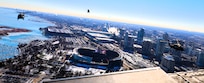 A diamond formation of Illinois Army National Guard helicopters performs a flyover over Soldier Field in Chicago on Dec. 14.