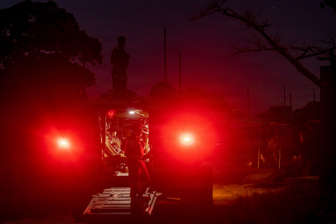 U.S. Marines with Kilo Company, Battalion Landing Team 3rd Battalion, 1st Marine Regiment, 31st Marine Expeditionary Unit, dismount amphibious combat vehicles during a mechanized raid on Camp Hansen, Okinawa, Japan, Dec. 05, 2025. The raid was conducted to enhance efficiency and efficacy of ship-to-shore operations utilizing mechanized assets. The 31st MEU, the Marine Corps’ only continuously forward-deployed MEU, provides a flexible and lethal force ready to perform a wide range of military operations as the premiere crisis response force in the Indo-Pacific region. (U.S. Marine Corps photo by Cpl. Maksim Masloboev)