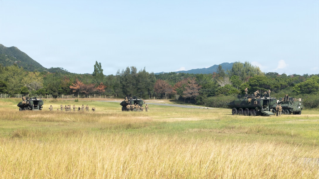U.S. Marines with Kilo Company, Battalion Landing Team 3rd Battalion, 1st Marine Regiment, 31st Marine Expeditionary Unit, dismount amphibious combat vehicles after a counter-attack scenario on Camp Hansen, Okinawa, Japan, Dec. 06, 2025. The raid was conducted to enhance efficiency and efficacy of ship-to-shore operations utilizing mechanized assets. The 31st MEU, the Marine Corps’ only continuously forward-deployed MEU, provides a flexible and lethal force ready to perform a wide range of military operations as the premiere crisis response force in the Indo-Pacific region. (U.S. Marine Corps photo by Cpl. Maksim Masloboev)