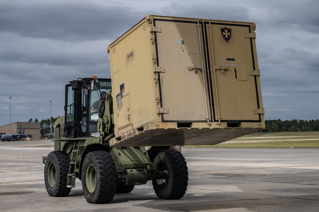 U.S. Air Force Airmen assigned to the 9th Airlift Squadron and 23rd Logistics Readiness Squadron load cargo from the 38th Rescue Squadron into a C-5M Super Galaxy at Moody Air Force Base, Georgia, Oct. 3, 2025.