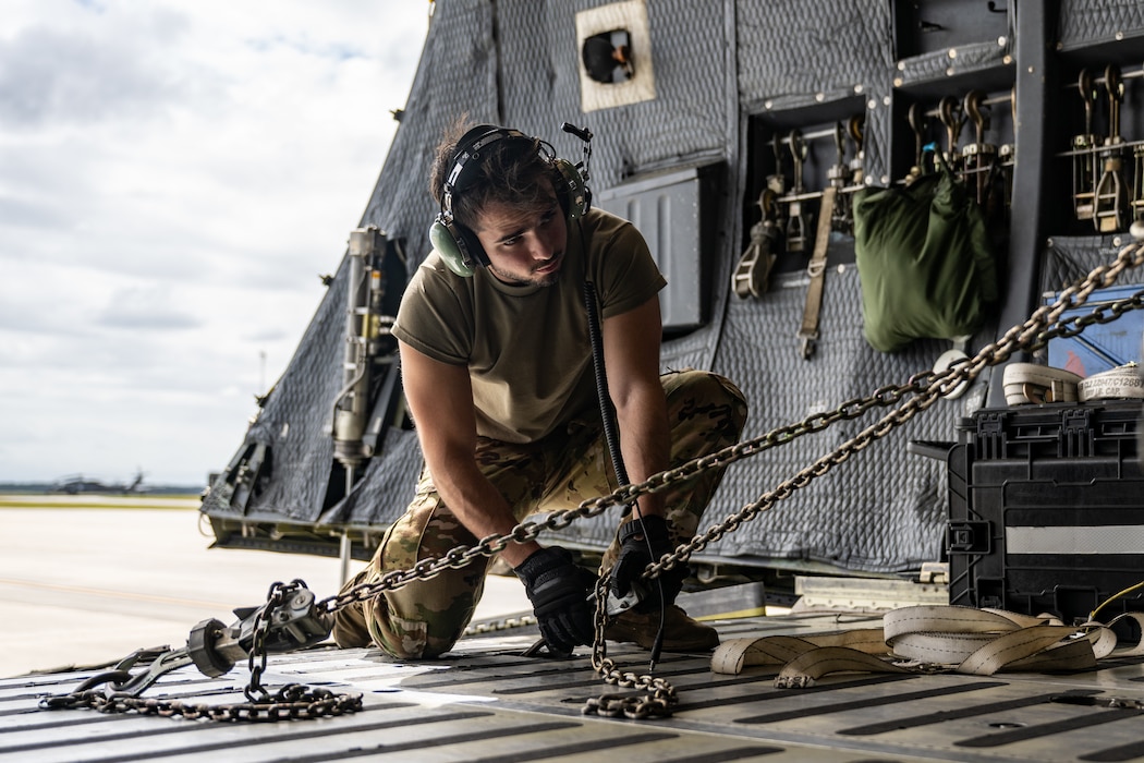 U.S. Air Force Airmen assigned to the 9th Airlift Squadron and 23rd Logistics Readiness Squadron load cargo from the 38th Rescue Squadron into a C-5M Super Galaxy at Moody Air Force Base, Georgia, Oct. 3, 2025.