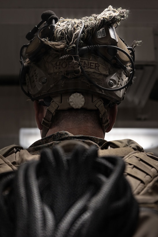 A U.S. Marine with Weapons Company, Battalion Landing Team 3rd Battalion, 1st Marine Regiment, 31st Marine Expeditionary Unit, walks to the flight deck aboard the forward-deployed amphibious assault carrier USS Tripoli (LHA 7), flagship of the Tripoli Expeditionary Strike Group, Dec. 3, 2025, while conducting routine operations in the U.S. 7th Fleet Area of Operations. Marines conducted call away drills in order to sustain mission capabilities in support of the 31st MEU. The 31st MEU, the Marine Corps’ only continuously forward-deployed MEU, provides a flexible and lethal force ready to perform a wide range of military operations as the premiere crisis response force in the Indo-Pacific region. (U.S. Marine Corps photo by Lance Cpl. Raul Sotovilla)