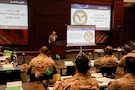 U.S. Central Command (CENTCOM) CCJ5 Countering Weapons of Mass Destruction (WMD) Division Chief, John K. Watson, delivers opening remarks during tabletop exercise Protection Shield at the University of Tampa, Dec. 8, 2025. CENTCOM, Department of Energy, Department of State, University of Tampa, and the Kingdom of Saudi Arabia Ministry of Defense, Ministry of Health, and Red Crescent participated in the consequence management tabletop exercise that aims to prevent, protect, and respond to incidents while improving interagency operability. (U.S. Central Command Public Affairs photo by Tom Gagnier)