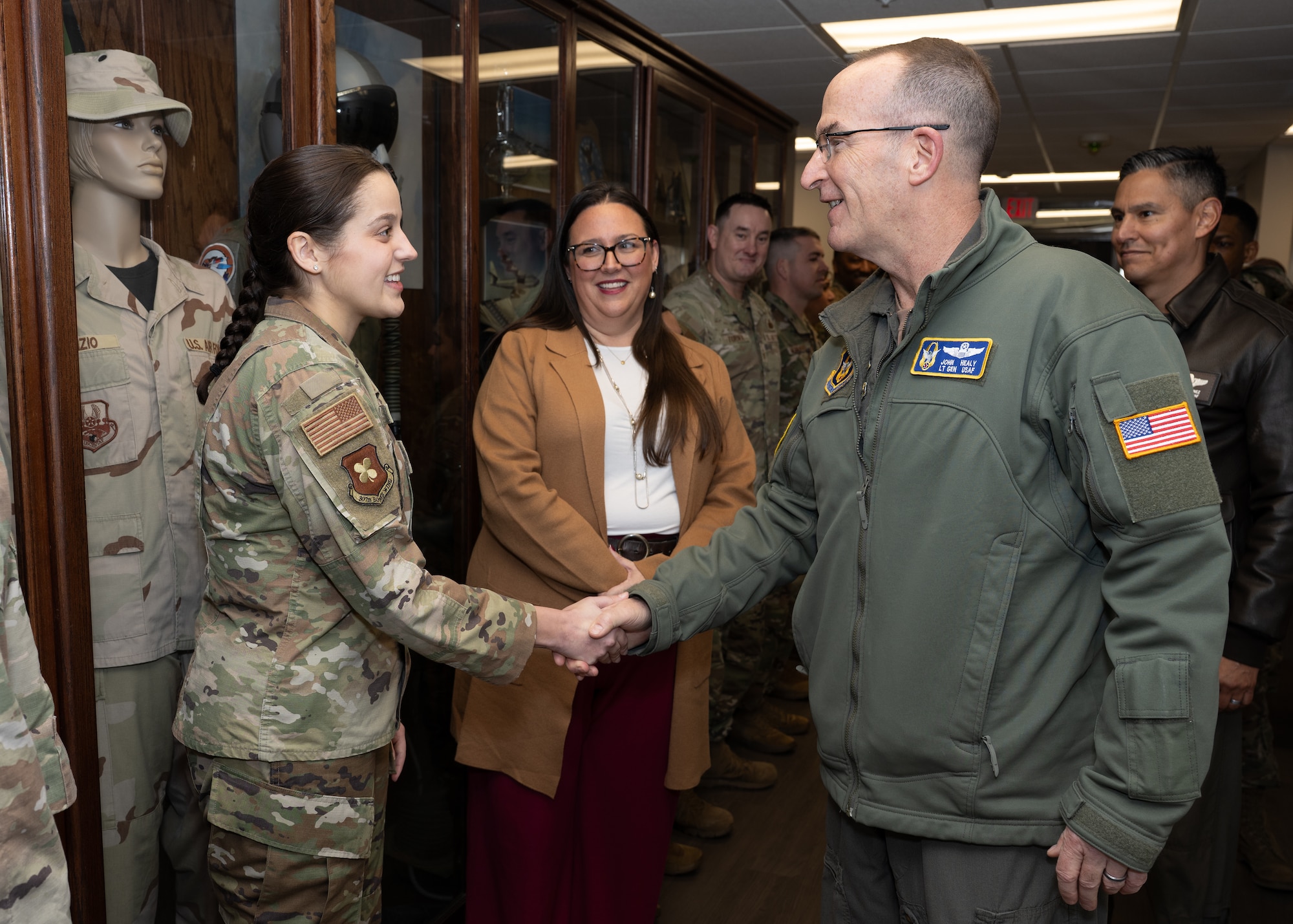 Lt. Gen. Healy shakes hand of Airmen.