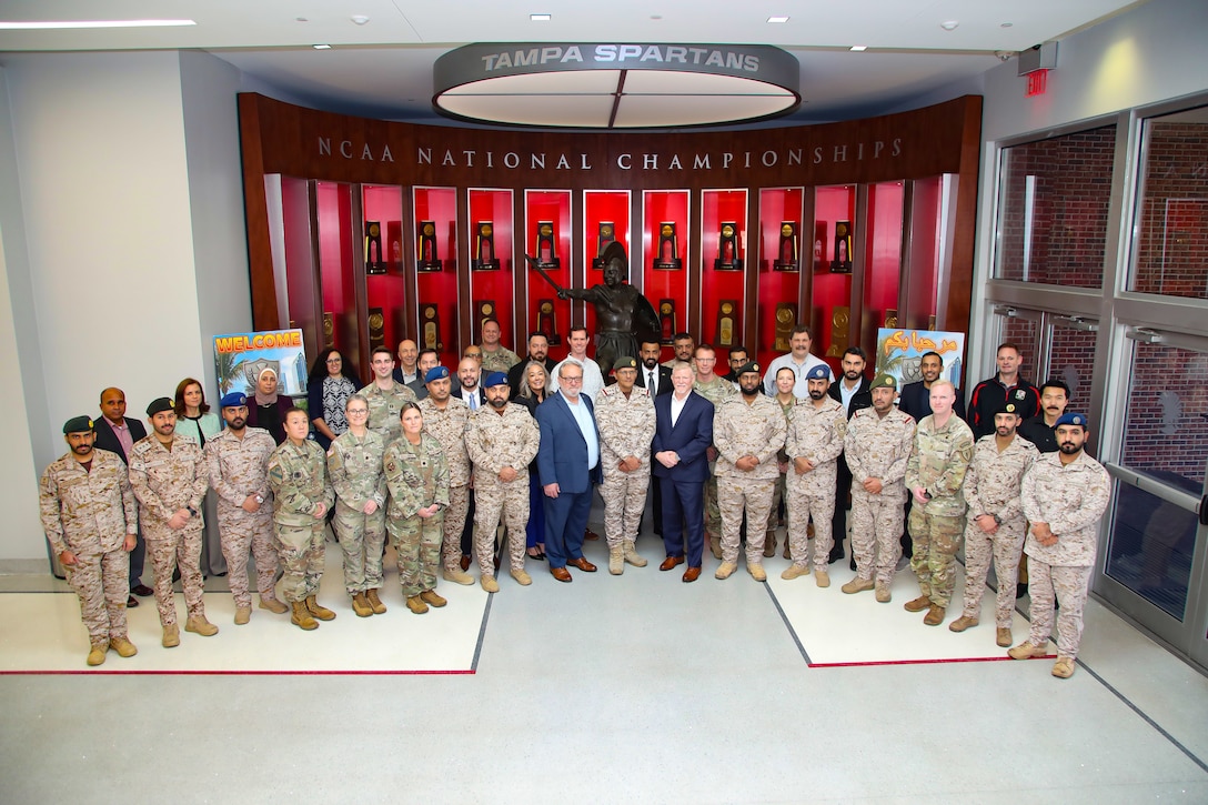 U.S. Central Command (CENTCOM), Department of Energy, Department of State, University of Tampa, and the Kingdom of Saudi Arabia Ministry of Defense, Ministry of Health, and Red Crescent pose for a group photo during tabletop exercise Protection Shield at the University of Tampa, Dec. 8, 2025. CENTCOM, the Kingdom of Saudi Arabia, and other subject matter experts participated in the consequence management tabletop exercise that aims to prevent, protect, and respond to incidents while improving interagency operability. (U.S. Central Command Public Affairs photo by Tom Gagnier)