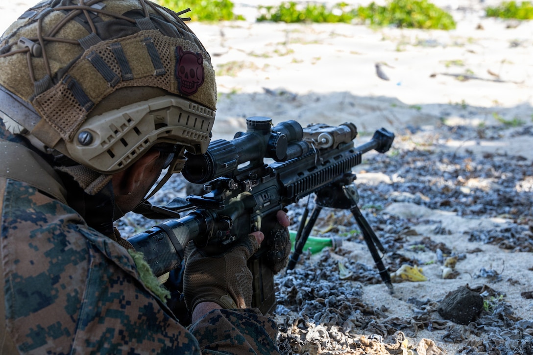 U.S. Marine Corps Cpl. Alvaro OrtizGarcia, a rifleman with India Company, Battalion Landing Team 3rd Battalion, 1st Marine Regiment, 31st Marine Expeditionary Unit, sets security during a small boat raid as part of MEU Exercise in Okinawa, Japan, Dec. 3, 2025. This training aimed to enhance the Marines ability to conduct boat raids using the enhanced combat rubber reconnaissance craft. The 31st MEU, the Marine Corps’ only continuously forward deployed MEU, provides a flexible and lethal force, ready to perform a wide range of military operations as the premiere crisis response force in the Indo-Pacific region. (U.S. Marine Corps photo by Cpl. Rebeka Falcon)