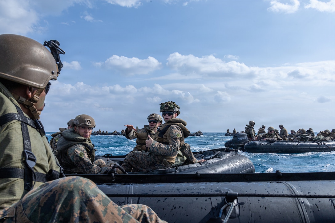 U.S. Marines with India Company, Battalion Landing Team 3rd Battalion, 1st Marine Regiment, 31st Marine Expeditionary Unit, navigate into a wedge formation during a small boat raid as part of MEU Exercise in Okinawa, Japan, Dec. 3, 2025. This training aimed to enhance the Marines ability to conduct boat raids using the enhanced combat rubber reconnaissance craft. The 31st MEU, the Marine Corps’ only continuously forward deployed MEU, provides a flexible and lethal force, ready to perform a wide range of military operations as the premiere crisis response force in the Indo-Pacific region. (U.S. Marine Corps photo by Cpl. Rebeka Falcon)
