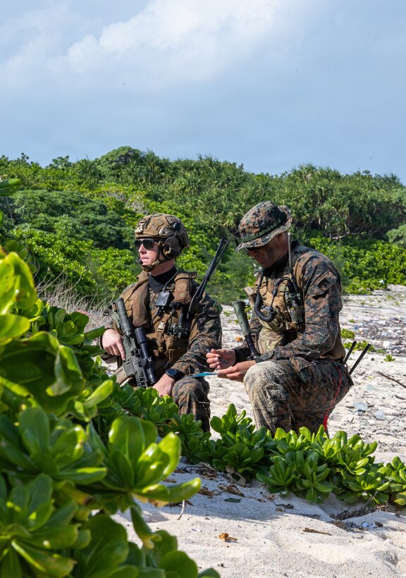 U.S. Marine Corps 1st Lt. Connor Morford (left) and 1st Lt. Alan Bond, both infantry man with India Company, Battalion Landing Team 3rd Battalion, 1st Marine Regiment, 31st Marine Expeditionary Unit, set security during a small boat raid as part of MEU Exercise in Okinawa, Japan, Dec. 3, 2025. This training aimed to enhance the Marines ability to conduct boat raids using the enhanced combat rubber reconnaissance craft. The 31st MEU, the Marine Corps’ only continuously forward deployed MEU, provides a flexible and lethal force, ready to perform a wide range of military operations as the premiere crisis response force in the Indo-Pacific region. (U.S. Marine Corps photo by Cpl. Rebeka Falcon)