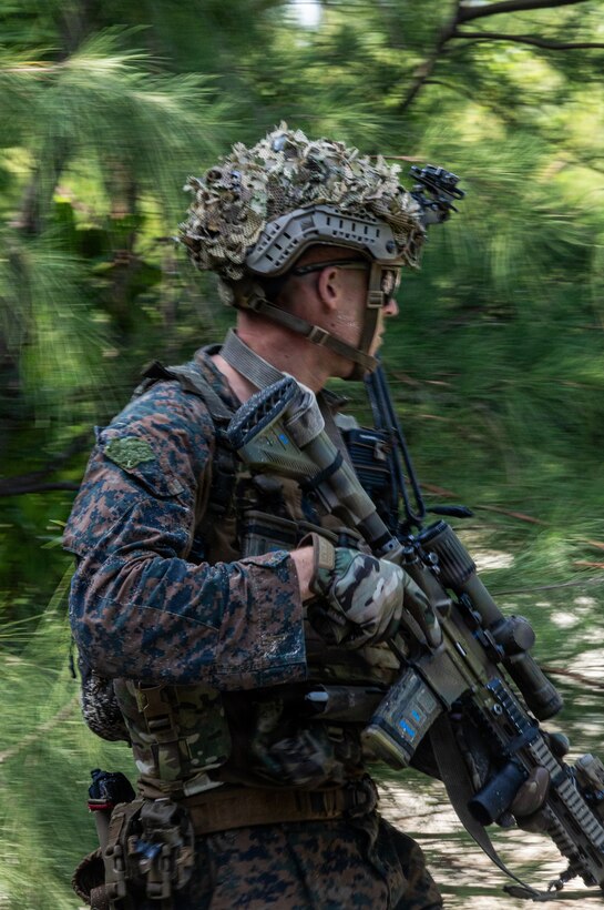 U.S. Marine Corps Sgt. Bo Olson, a rifleman with India Company, Battalion Landing Team 3rd Battalion, 1st Marine Regiment, 31st Marine Expeditionary Unit, sets security during a small boat raid as part of MEU Exercise in Okinawa, Japan, Dec. 3, 2025. This training aimed to enhance the Marines ability to conduct boat raids using the enhanced combat rubber reconnaissance craft. The 31st MEU, the Marine Corps’ only continuously forward deployed MEU, provides a flexible and lethal force, ready to perform a wide range of military operations as the premiere crisis response force in the Indo-Pacific region. (U.S. Marine Corps photo by Cpl. Rebeka Falcon)