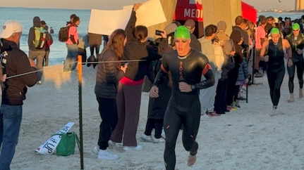 John Kremar, NSWC PCD Diving and Life Support lead engineer, looks to complete the first leg of the triathlon and heads towards the biking event during IRONMAN Florida 2025, Nov. 1. Kremar also attended the Naval Diving and Salvage Training Center’s “Diving School” which qualifies him to dive in the equipment his group develops and delivers to the warfighter. (courtesy photo)