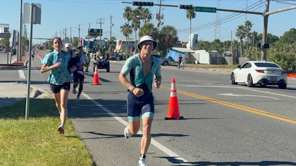 John Kremar, NSWC PCD Diving and Life Support lead engineer, gets closer to completing the final leg of the IRONMAN Florida 2025 triathlon, Nov. 1. He completed the competition in under 9 hours, which is something only 95 amateurs have achieved throughout this event’s history. (courtesy photo)