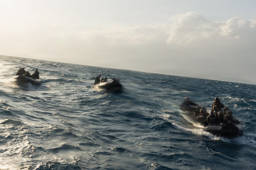 U.S. Marines with India Company, Battalion Landing Team 3rd Battalion, 1st Marine Regiment, 31st Marine Expeditionary Unit, prepare to embark an autonomous low-profile vessel during unmanned surface vessel training operations as part of MEU Exercise at White Beach Naval Facility, Okinawa, Japan on Dec. 3, 2025. The ALPV has the ability to deliver multiple variations of supplies and equipment through contested maritime terrain. The 31st MEU, the Marine Corps’ only continuously forward deployed MEU, provides a flexible and lethal force, ready to perform a wide range of military operations as the premiere crisis response force in the Indo-Pacific region. (U.S. Marine Corps photo by Sgt. Alora Finigan)