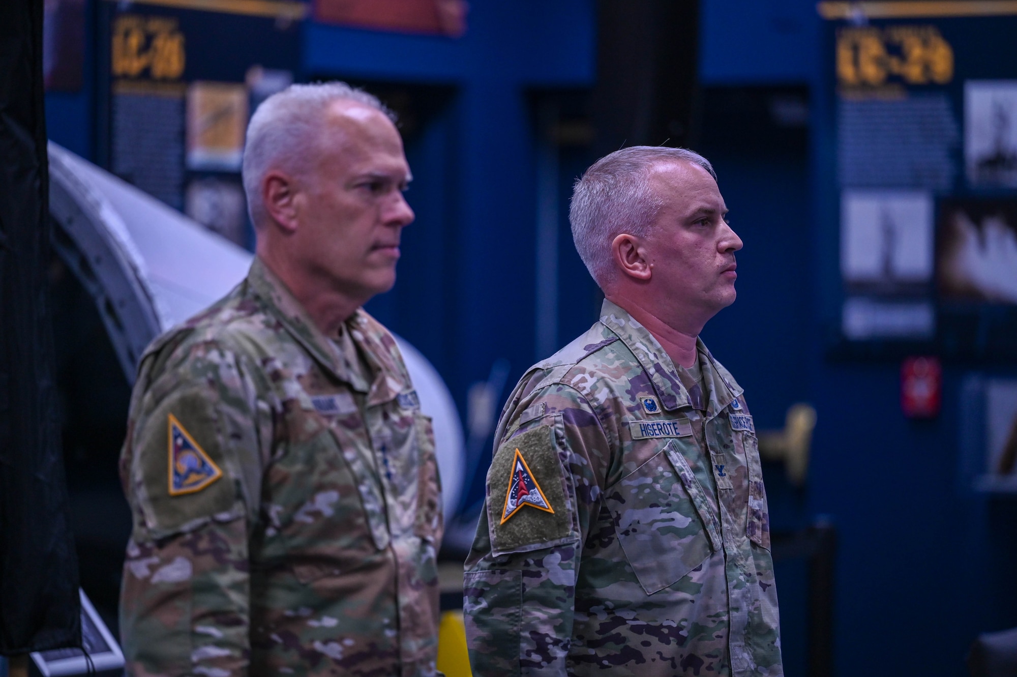 U.S. Space Force Lt. Gen. Philip Garrant, left, commander of Space Systems Command, and U.S. Space Force Col. Ryan Hiserote stand at attention as orders are read during the System Delta 80 (SYD 80) stand-up ceremony at Cape Canaveral Space Force Station, Fla., Dec. 12. The ceremony formally recognized the establishment of SYD 80, which will focus on launch solutions, on-orbit servicing, and range systems. (U.S. Space Force photo/SrA Samuel Becker)