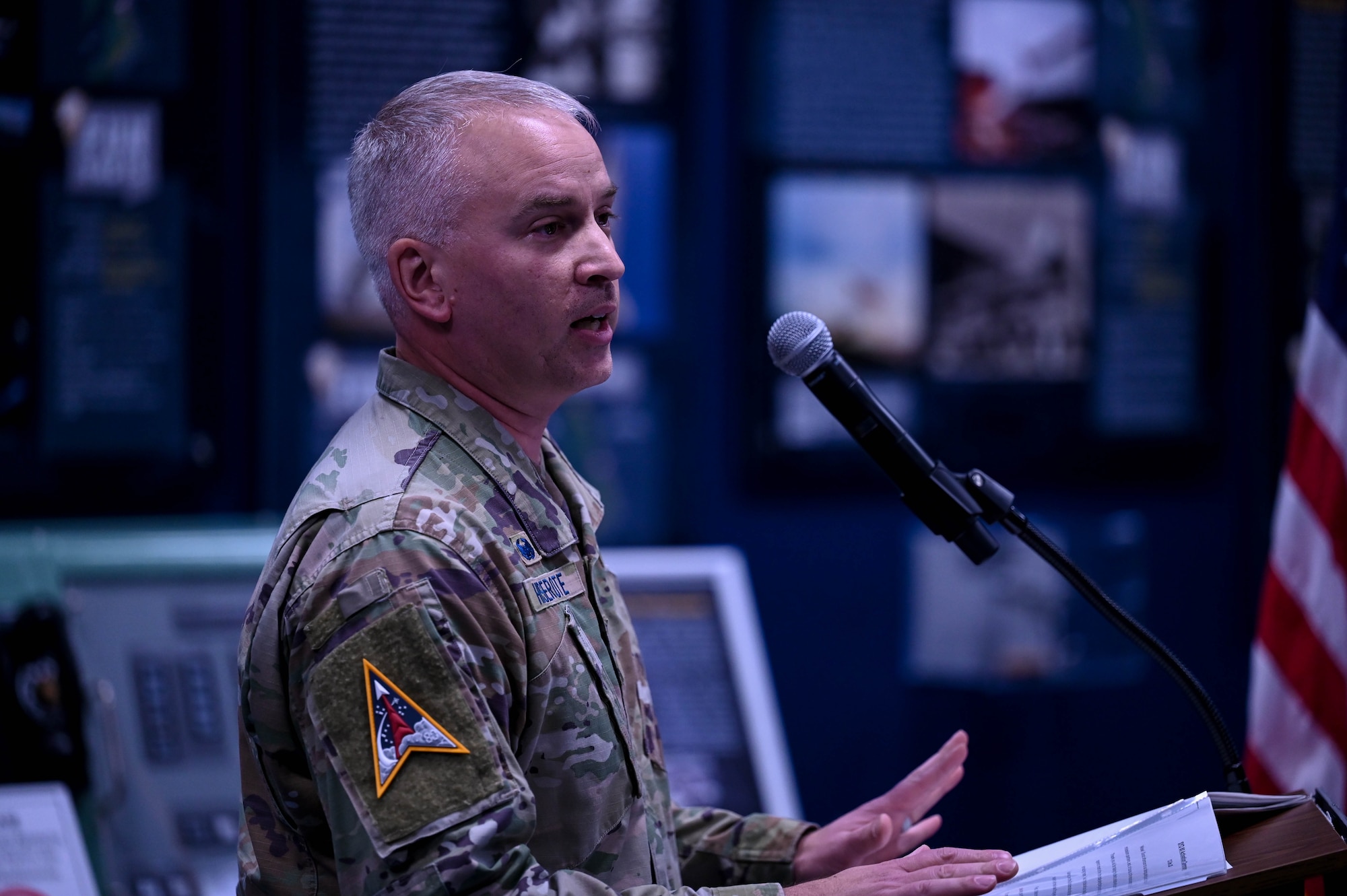 U.S. Space Force Col. Ryan Hiserote addresses attendees during the System Delta 80 (SYD 80) stand-up ceremony at Cape Canaveral Space Force Station, Fla., Dec. 12. Hiserote will lead SYD 80 in rapidly fielding critical capabilities for launch solutions, range systems, and emerging servicing, mobility, and logistics. (U.S. Space Force photo/SrA Samuel Becker)