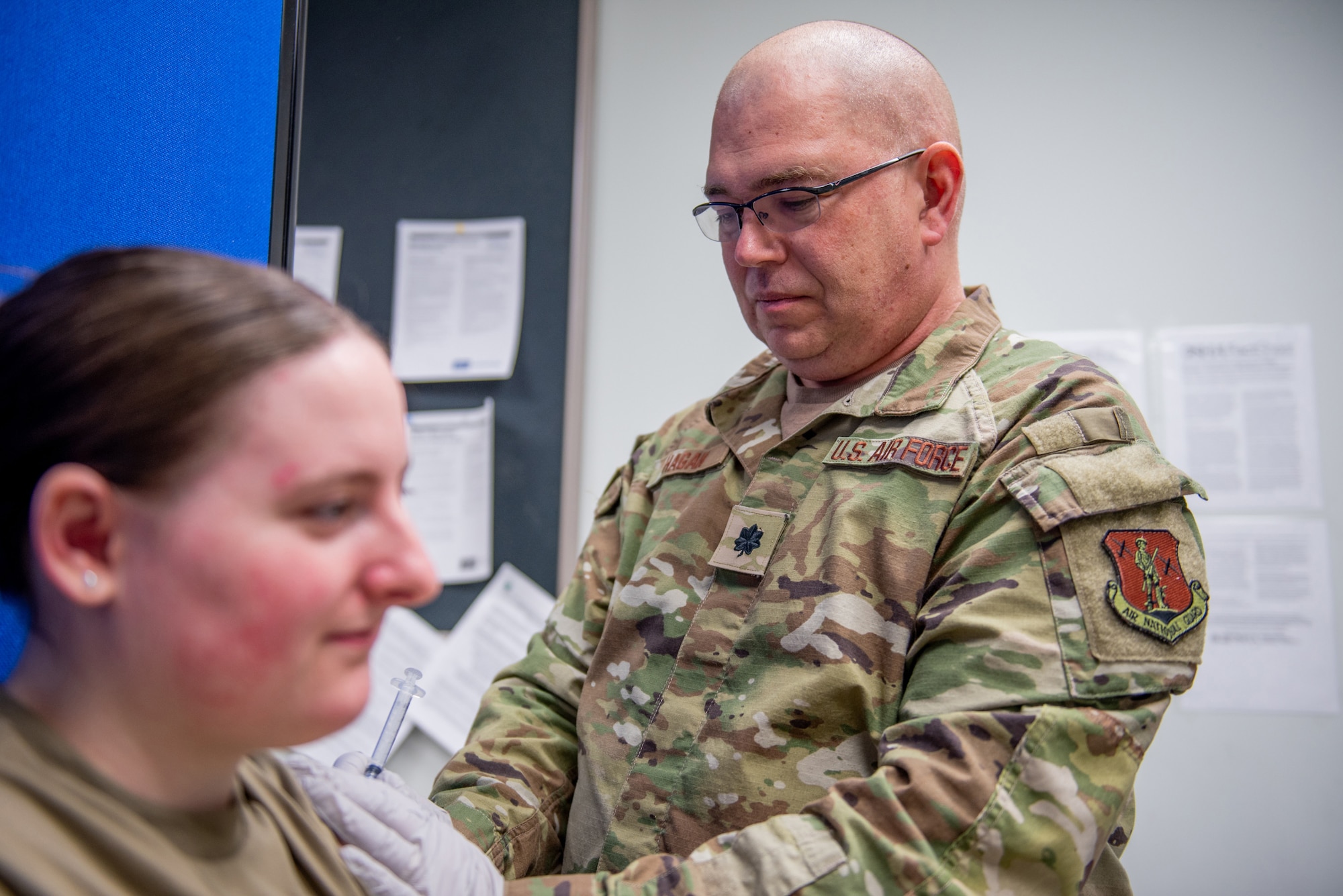Lt. Col. Thomas Hagan, chief nurse in the 123rd Medical Group, administers a vaccination at the Kentucky Air National Guard Base in Louisville, Ky., April, 12, 2025. Hagan earned the Air National Guard Outstanding Excellence in Nursing Leadership Award from the National Guard Bureau for 2024. (U.S. Air National Guard photo by Angelee Barnett)