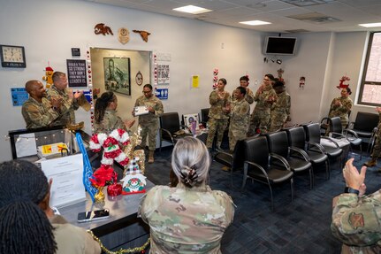 The U.S. Air Force’s 11th Wing leadership and members of the 11th Military Personnel Flight applaud for U.S Air Force Tech. Sgt. Tomarra Woods, the noncommissioned officer in charge of outbound assignments with the 11th MPF, during a Stripes for Exceptional Performers promotion ceremony on Joint Base Anacostia-Bolling, Washington, D.C., Nov. 25, 2025. The STEP promotion program authorized Col. James M. Clark, commander of JBAB and the 11th Wing, to immediately promote Woods for exceptional performance. (U.S. Air Force photo by Hayden Hallman)