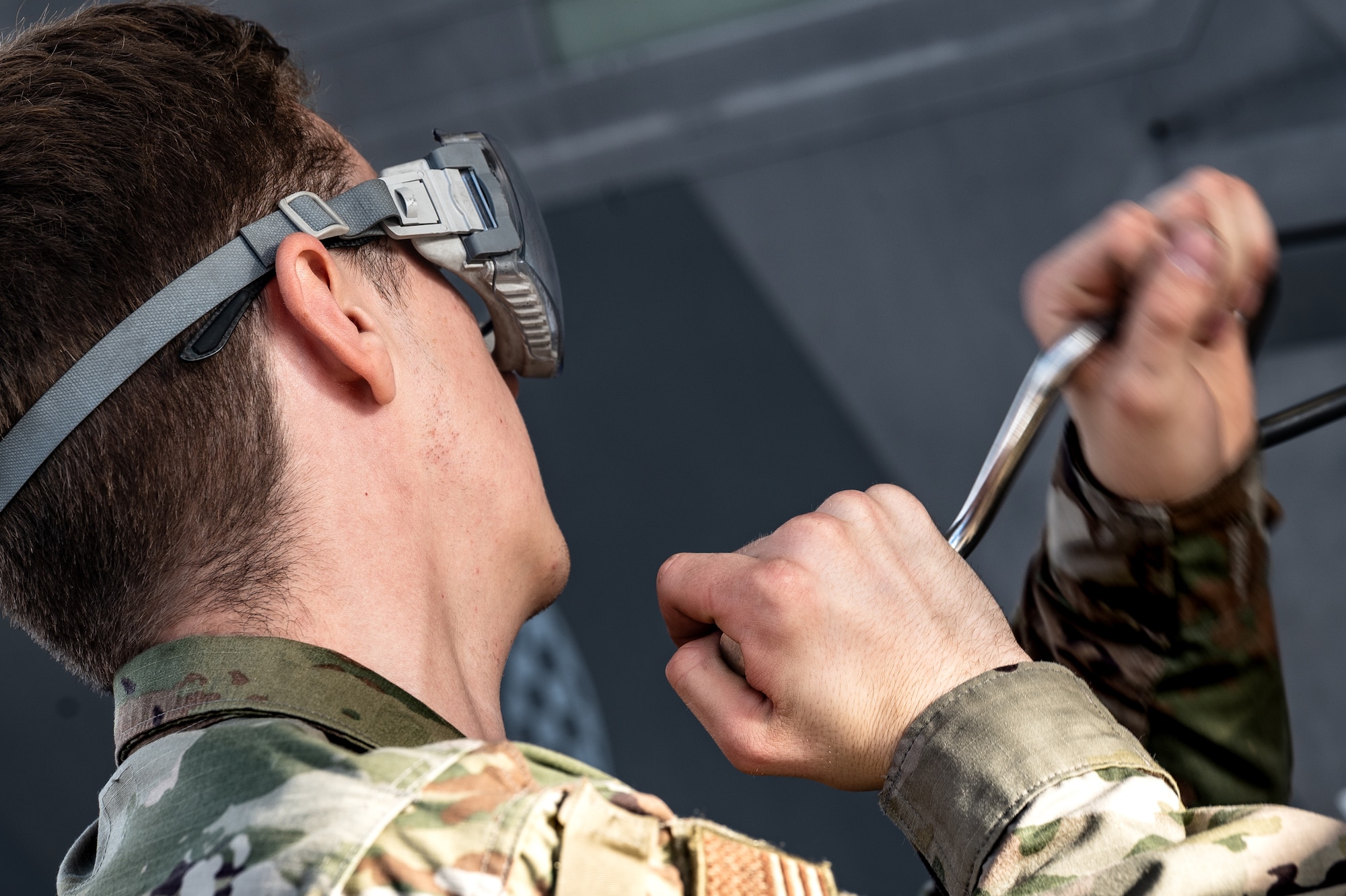 U.S. Air Force Airman Wilson Swithenbank, 308th Aircraft Maintenance Unit F-35 integrated avionics technician apprentice, performs maintenance on an F-35A Lightning II