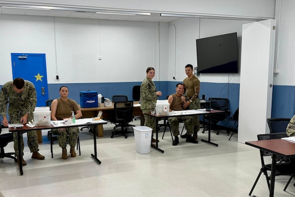 251015-N-FT324-4982. ROTA, Spain (Oct. 15, 2025) — Staff from Navy Medicine Readiness and Training Command (NMRTC) Rota set up mass influenza vaccination sites during the command’s annual flu campaign, supporting Force Health Protection and operational readiness across the joint force. The campaign supported service members, families, and civilians across the installation. (U.S. Navy Photo Released by Lt. Cmdr. Alicia Sacks)