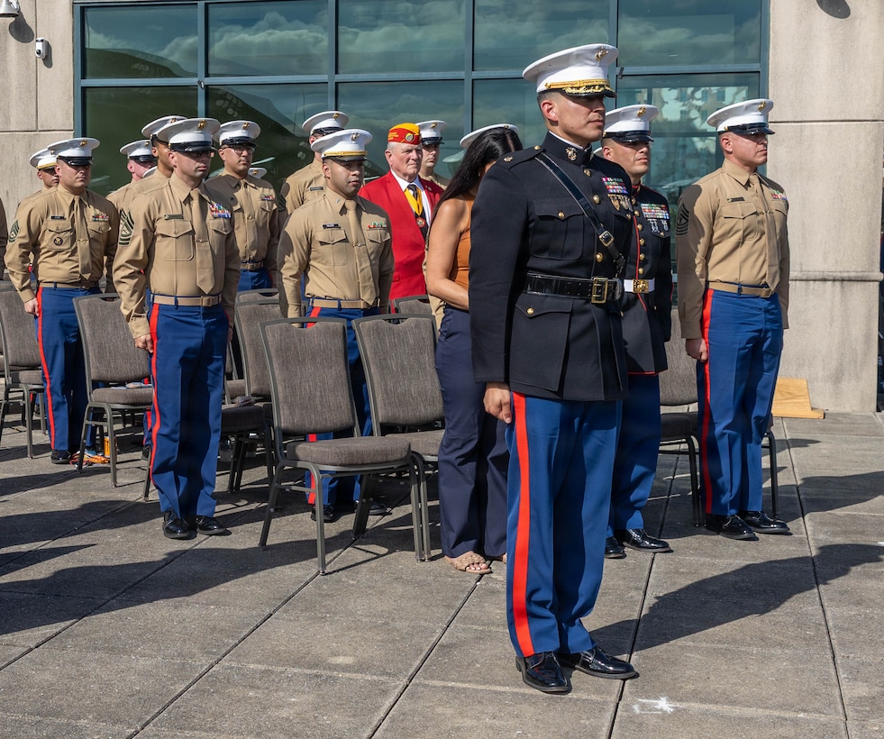 U.S. Marine Corps Maj. Nelson Lovos, the commanding officer of Recruiting Station South Texas, 8th Marine Corps District, stands at the position of attention during the playing of Anchors Away in part of the activation ceremony for Recruiting Station South Texas  Nov. 6, 2025, in Houston, Texas. RS South Texas was established to better support the Marine Corps recruiting mission by bridging the gap between the community and the Corps, providing talented young Americans with career opportunities that promote professional and personal growth. (U.S. Marine Corps Photo by Cpl. Christian Salazar)