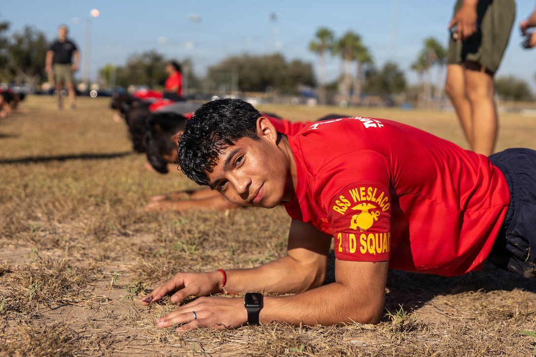 A U.S. Marine Corps Poolee with Marine Recruiting Sub Station Weslasco, Recruiting Station South Texas, performs a plank during an initial strength test in Weslaco Texas, Nov. 8, 2025. The pool function served as an opportunity for future Marines to build camaraderie and experience firsthand some of the rigors they will face during recruit training. (U.S. Marine Corps Photo by Cpl.Christian Salazar)