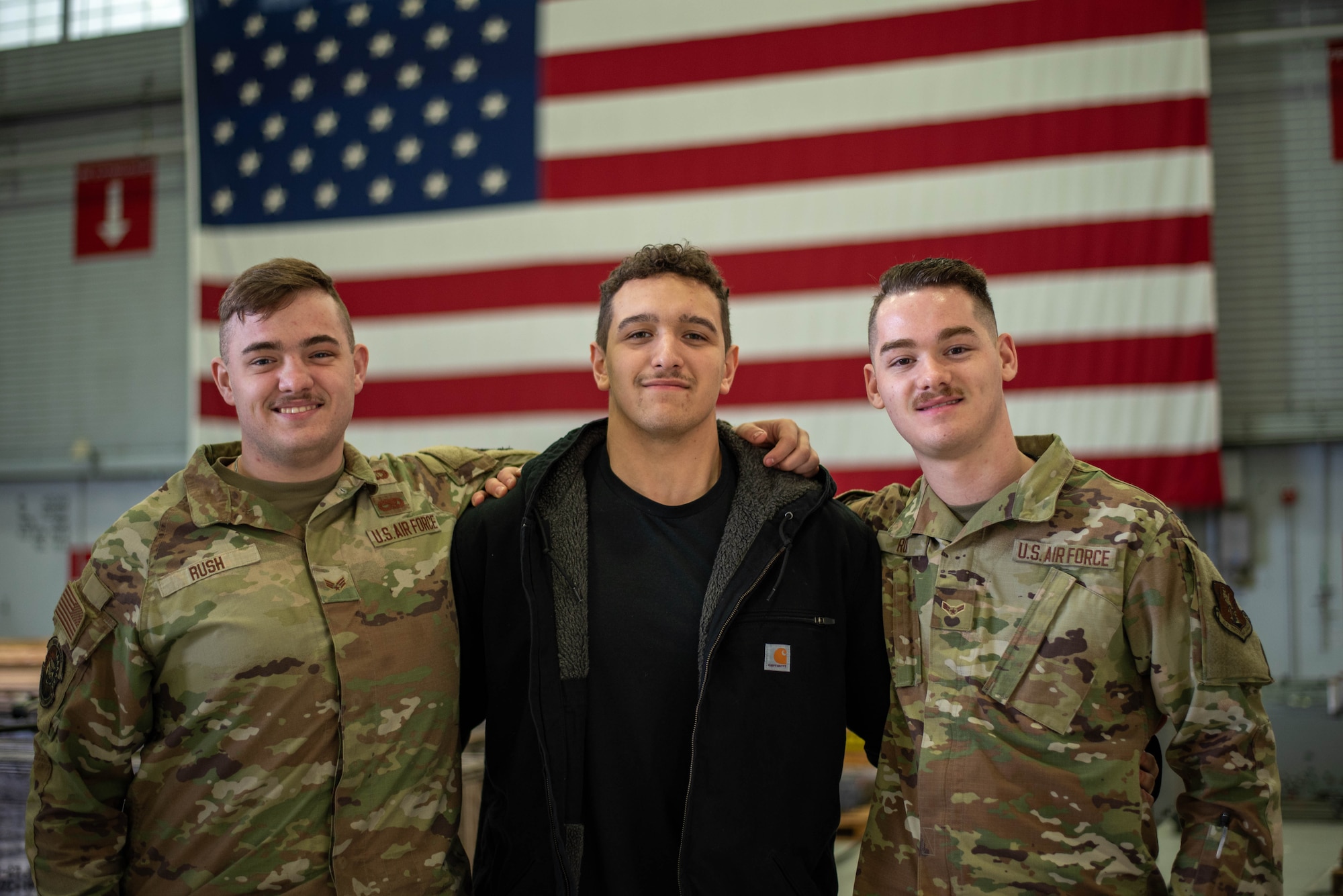Three brothers: Senior Airman Eithan Rush (left), 142nd Maintenance Squadron (MXS), Airman 1st Class Wyatt Rush (right), 142nd Aircraft Maintenance Squadron, and Jayden Mancilla, a new recruit coming into the propulsion flight in the 142nd MXS, pose for a group photo at Portland Air National Guard Base, Portland, Ore., Dec. 6, 2025.