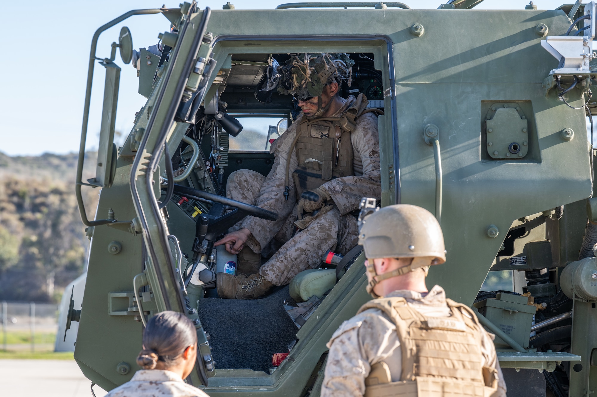 Marines board a C-130J Super Hercules