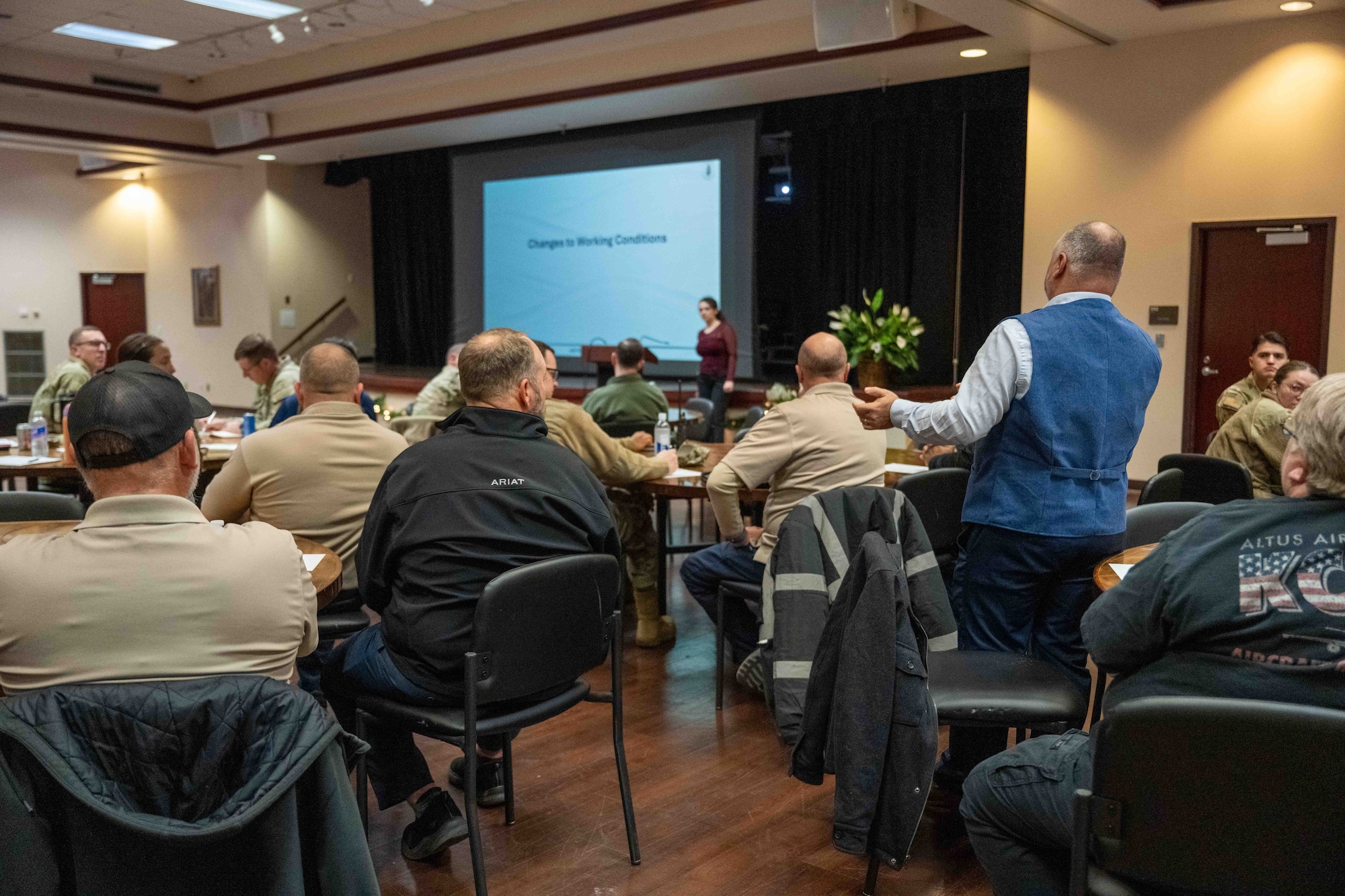 An attendee of the civil law symposium asks a question to the speaker at Altus Air Force Base, Oklahoma, Dec. 8, 2025. The symposium brought together Air Force legal professionals to discuss civil law topics and strengthen coordination, helping attendees better understand military support roles and improving readiness for real-world scenarios.(U.S. Air Force photo by Airman 1st Class Nathan Langston)