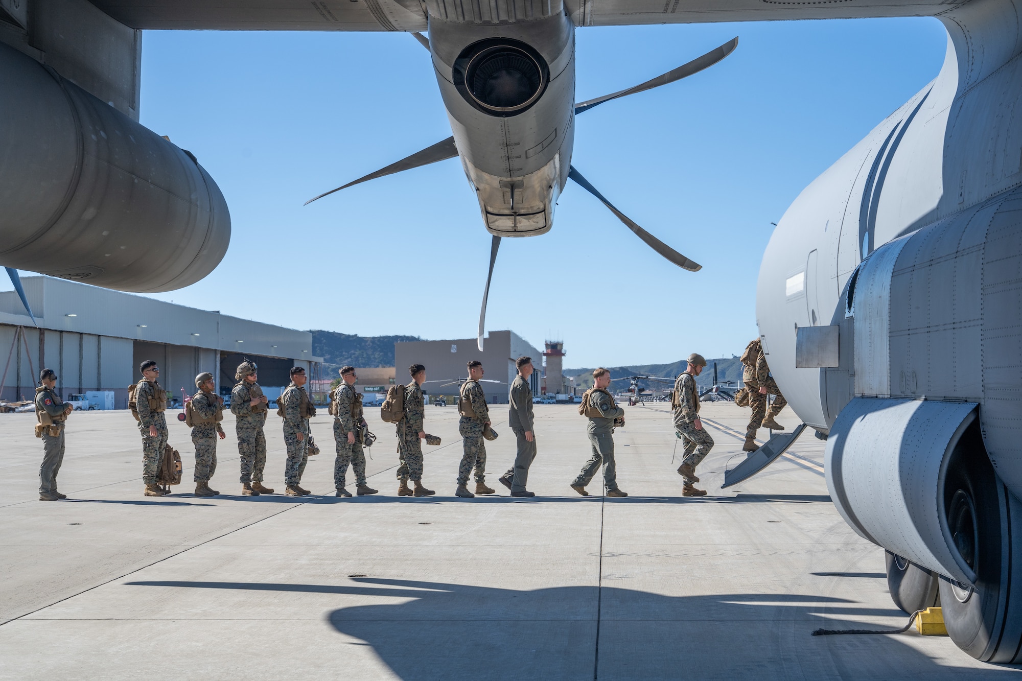 Airmen and Marines work together out on the flightline