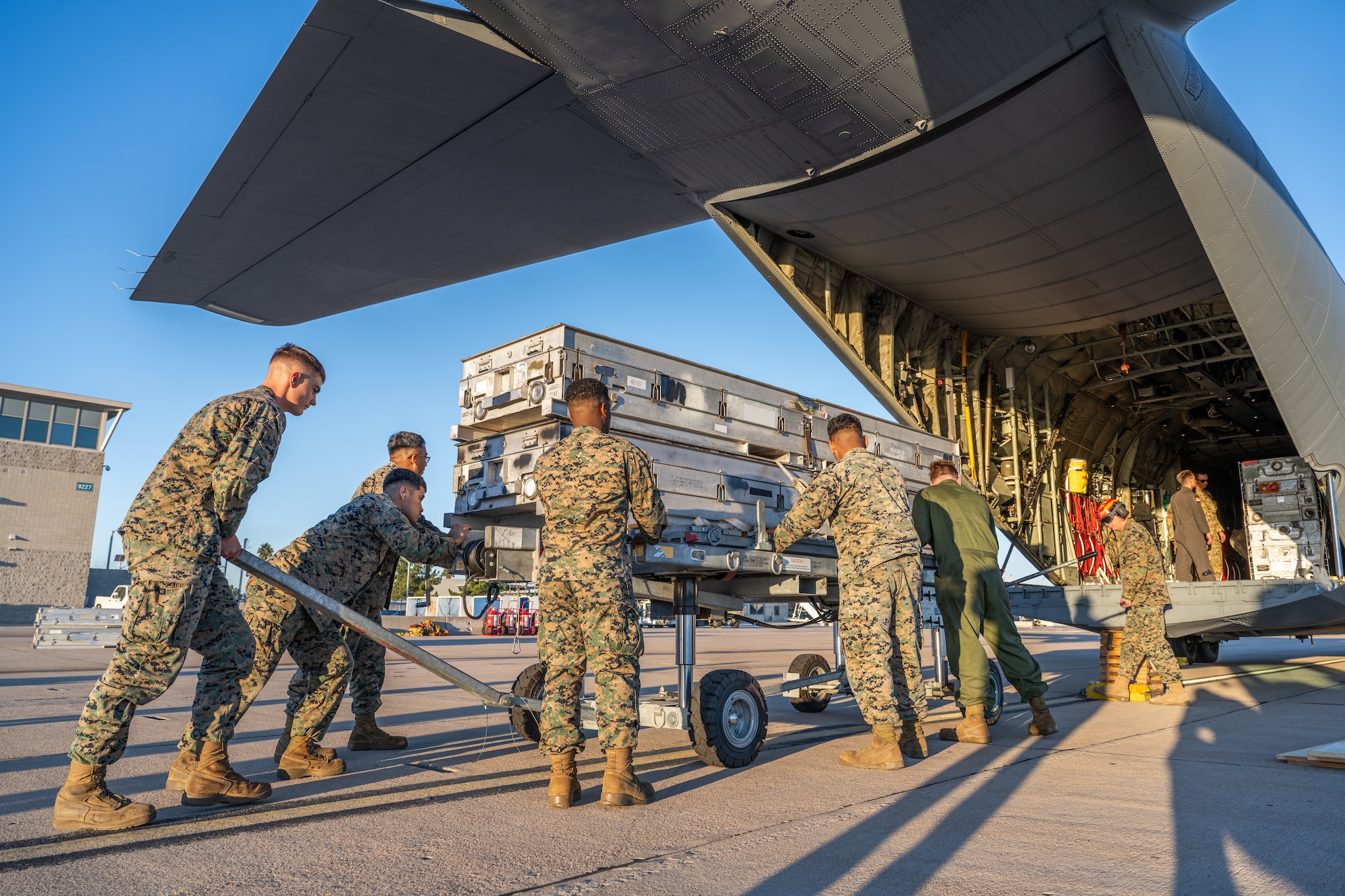 Airmen and Marines work together out on the flightline